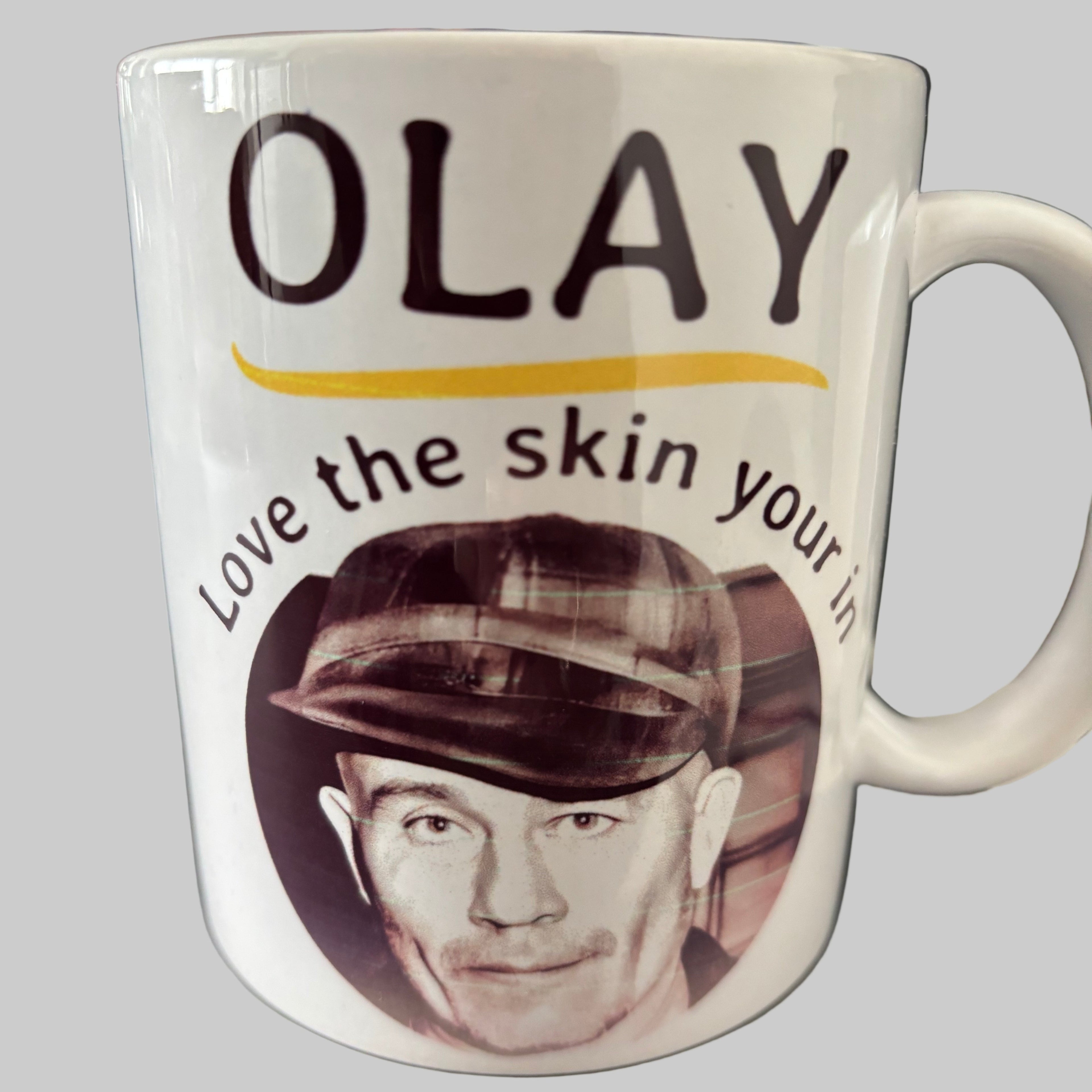 Olay mug with a black and white portrait on a blurred background